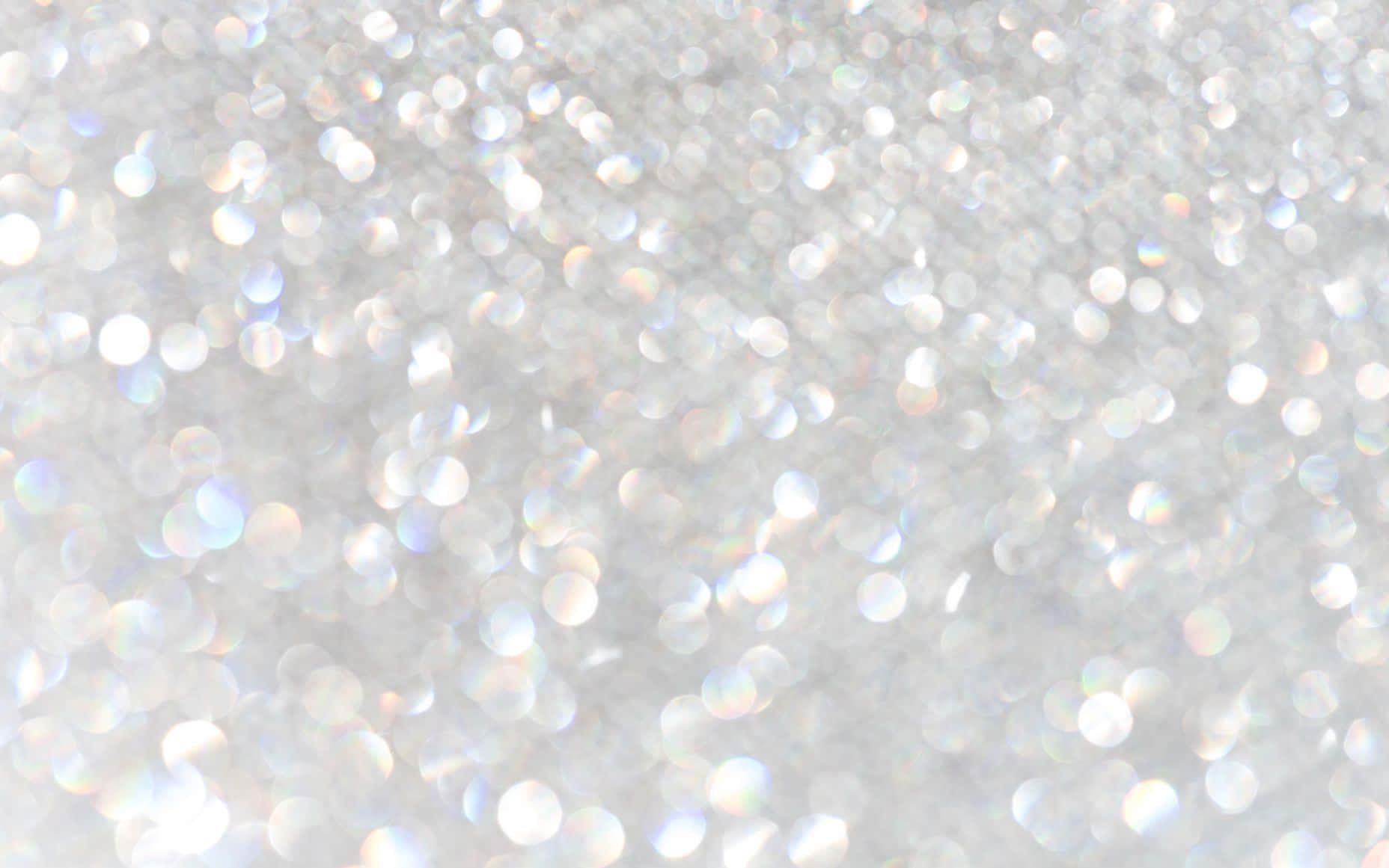 Gold And Silver Glitter Against A White Background Background
