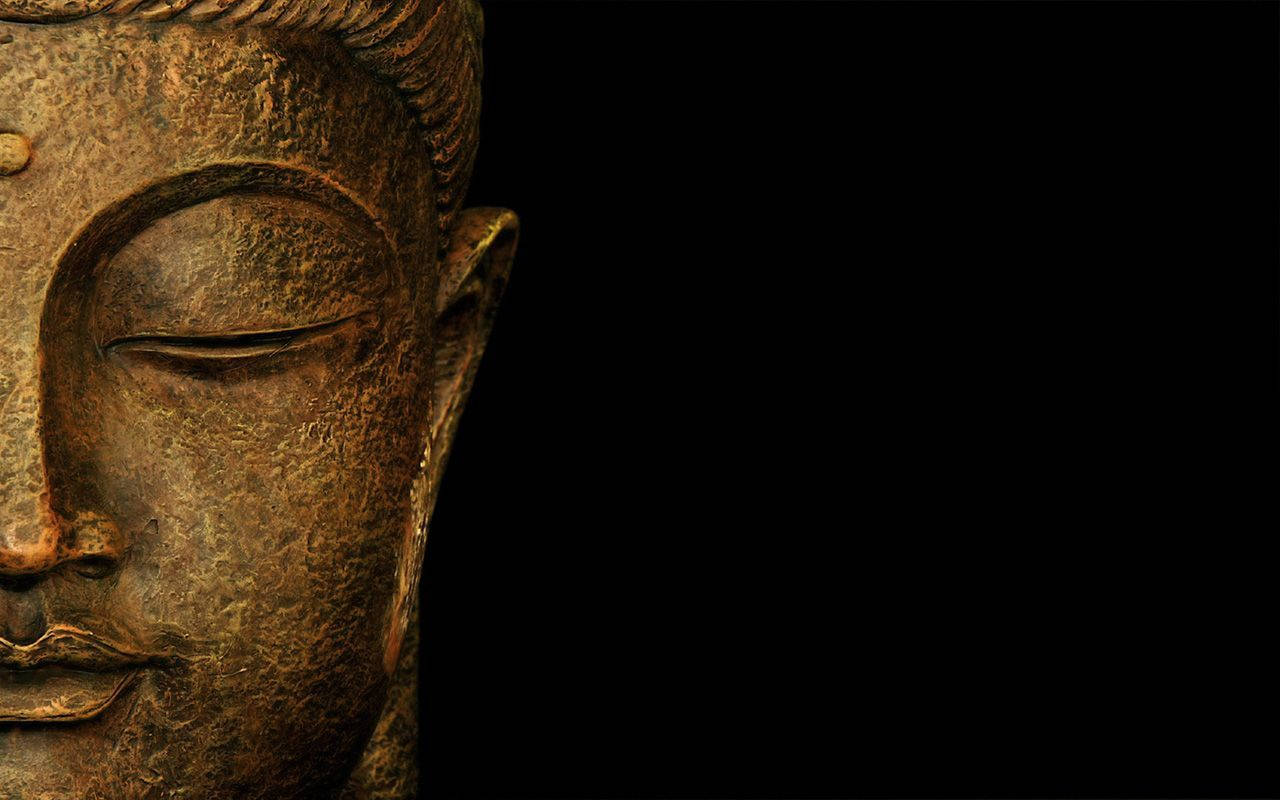 Gold Buddha In Black Background