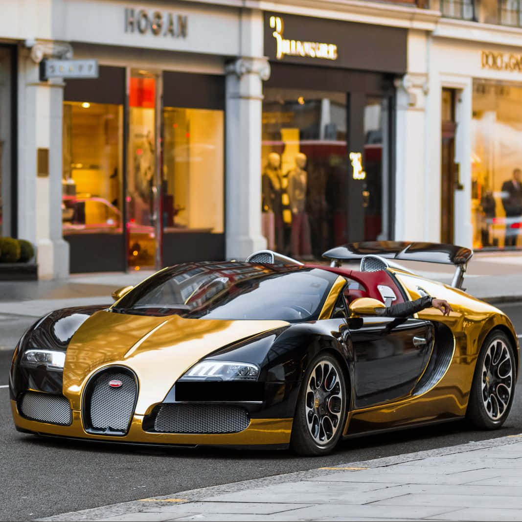 Gold Bugatti Veyron Car With Stores Background