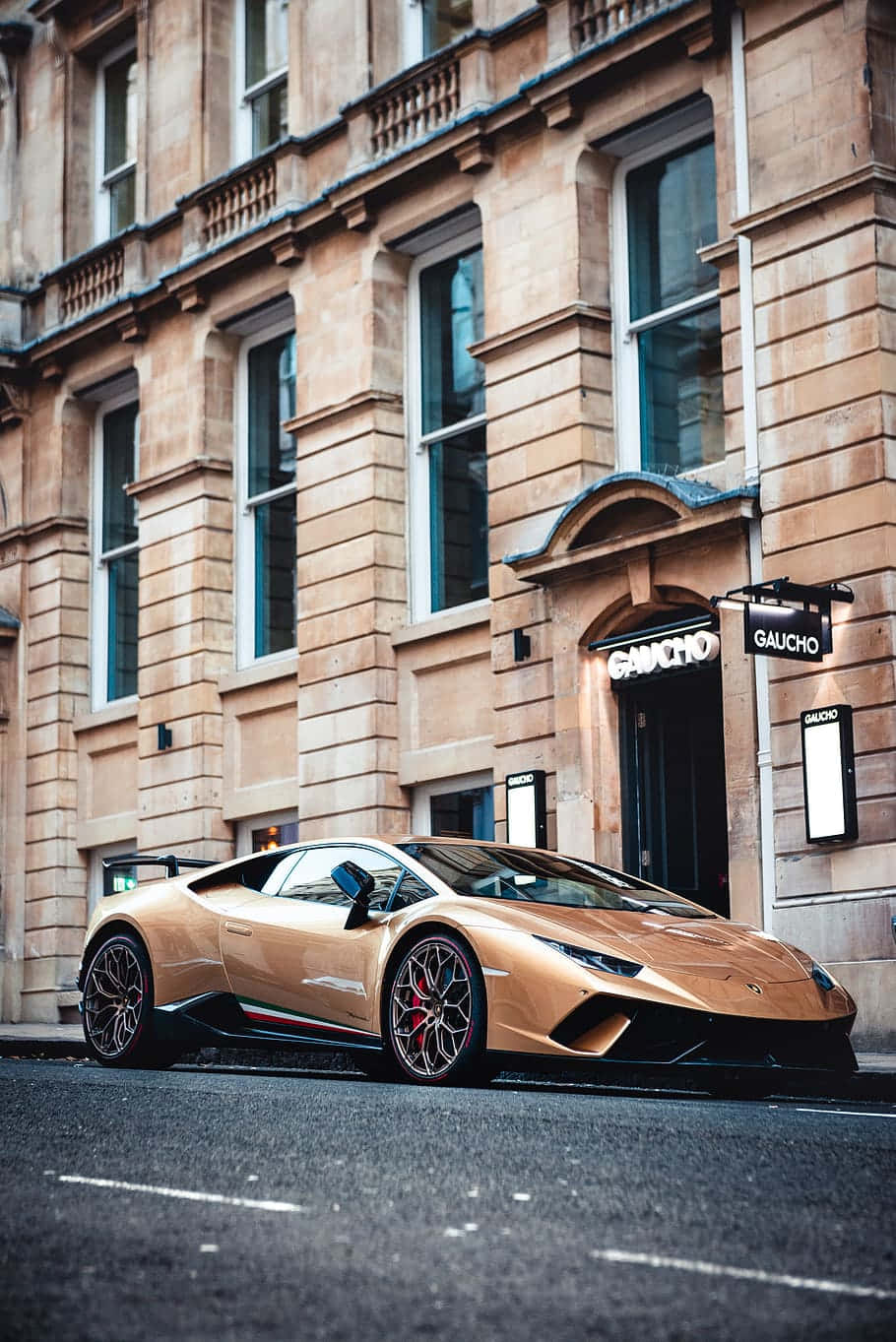 Gold Cars Lamborghini In City Background