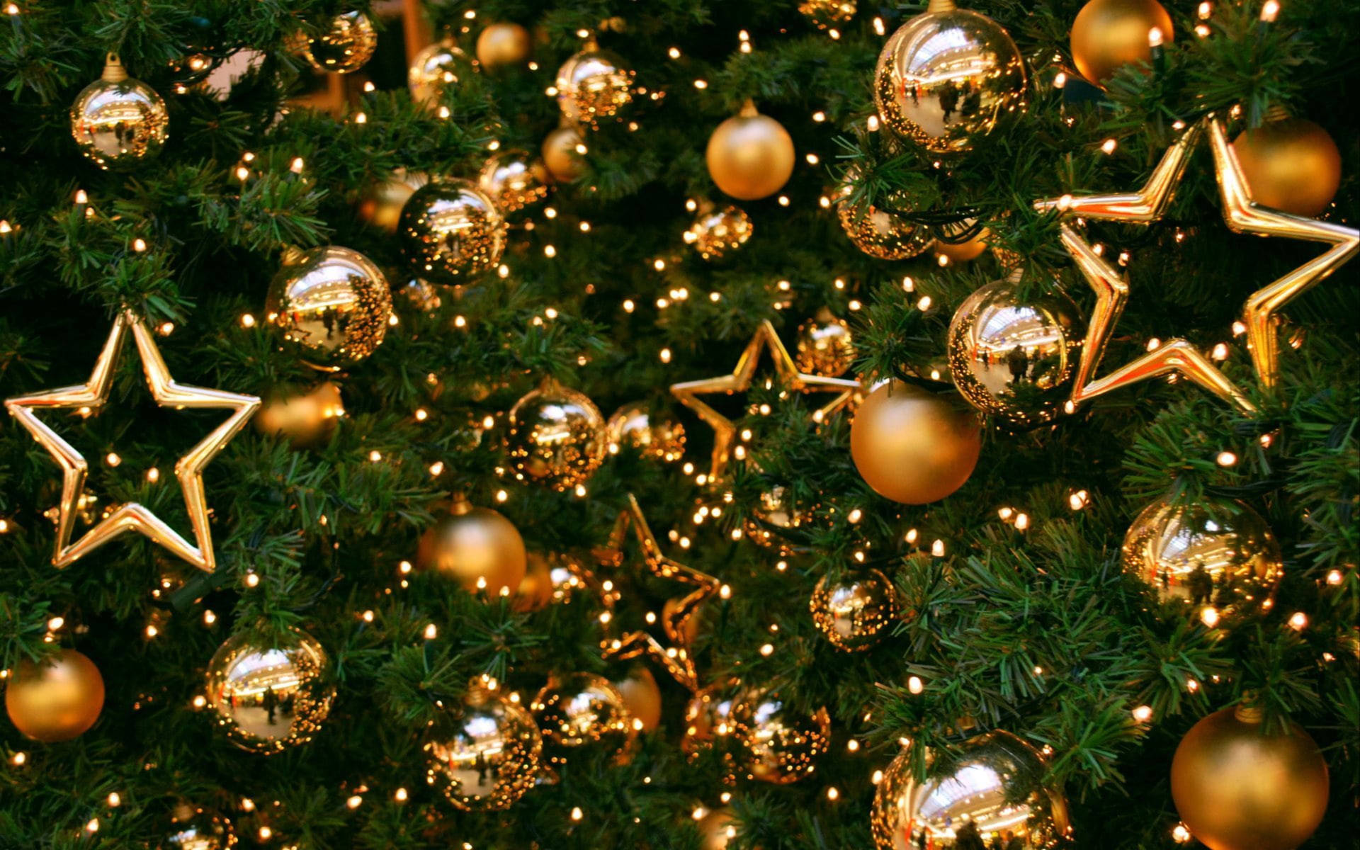 Gold Christmas Balls At Fir Tree Background