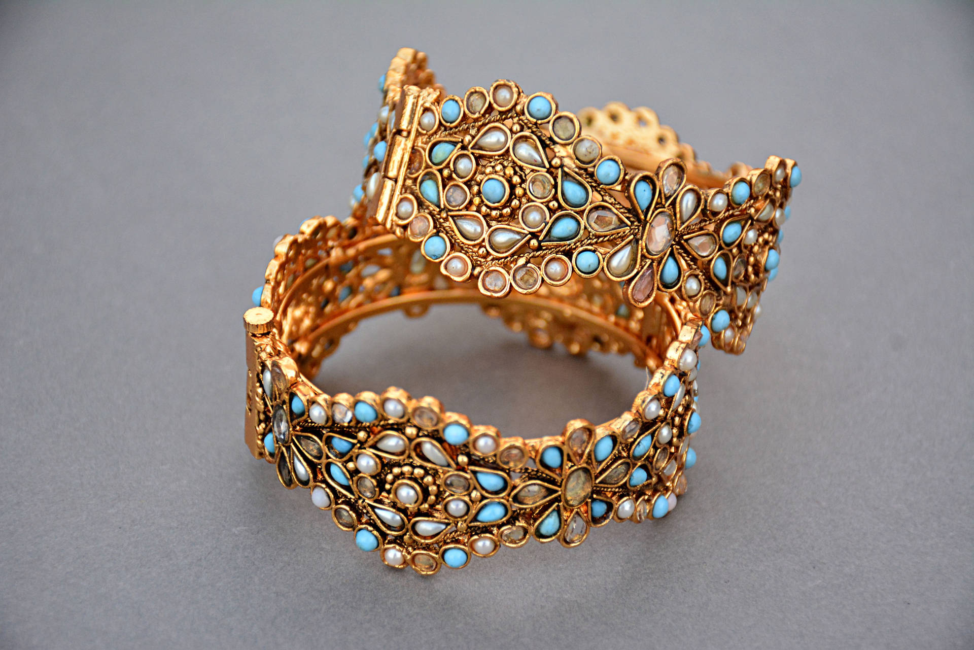 Gold Jewellery With Blue Stones Background