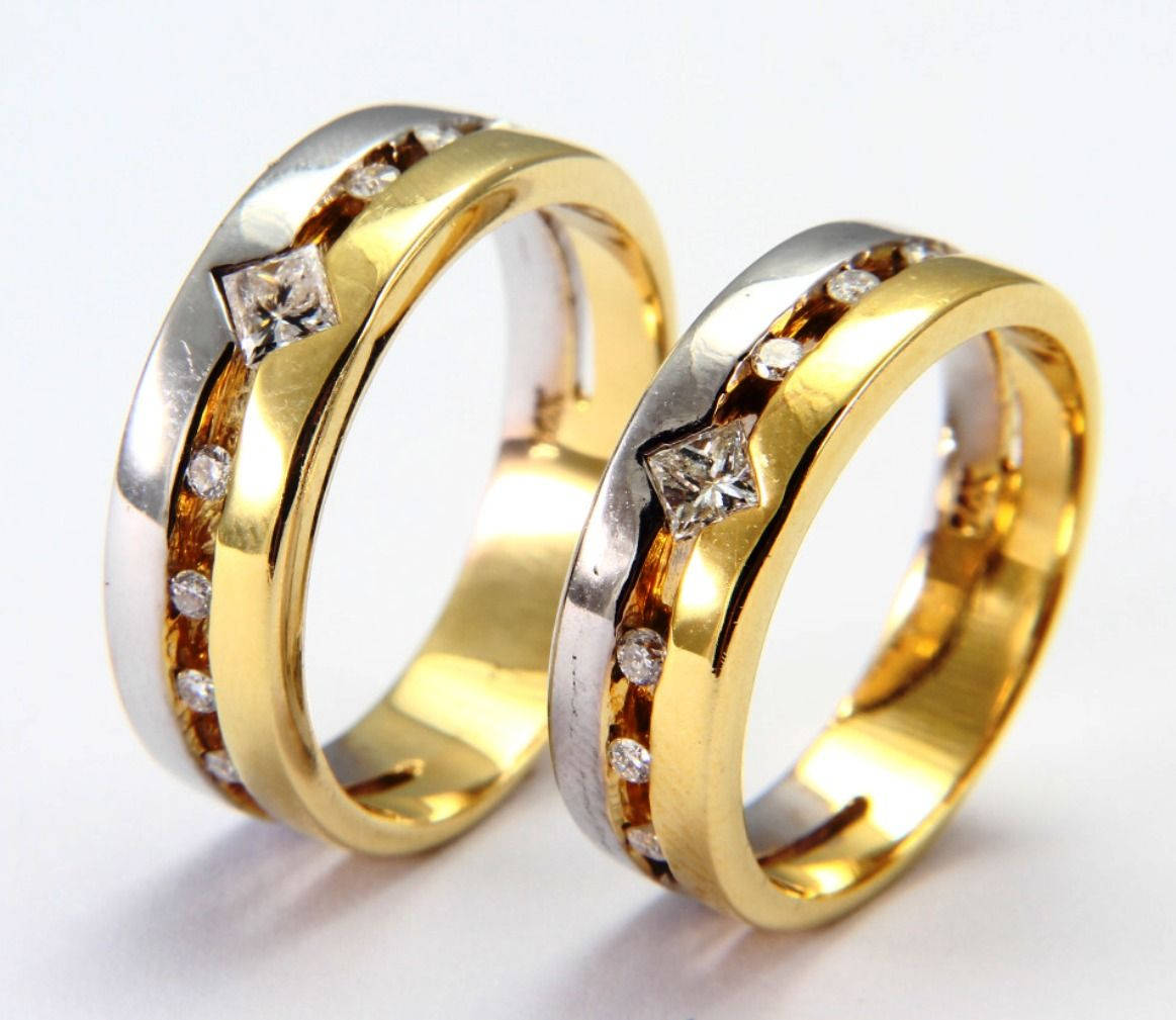 Gold Wedding Rings With Silver Background