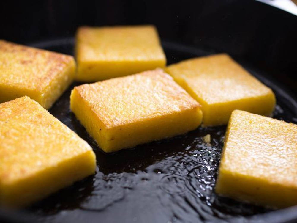 Golden Frying Polenta Cakes Background