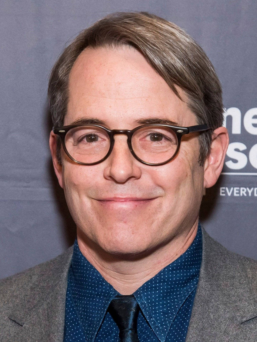 Golden Globe Nominee Matthew Broderick Smiling At Event Background