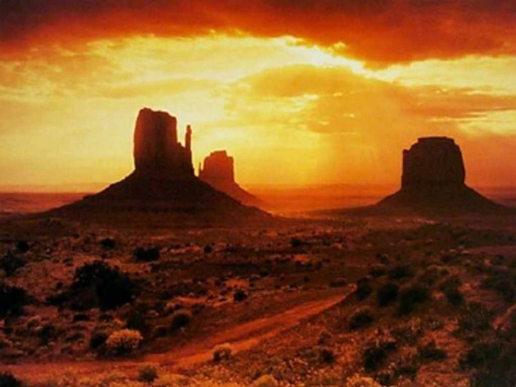 Golden Glow At Monument Valley Background