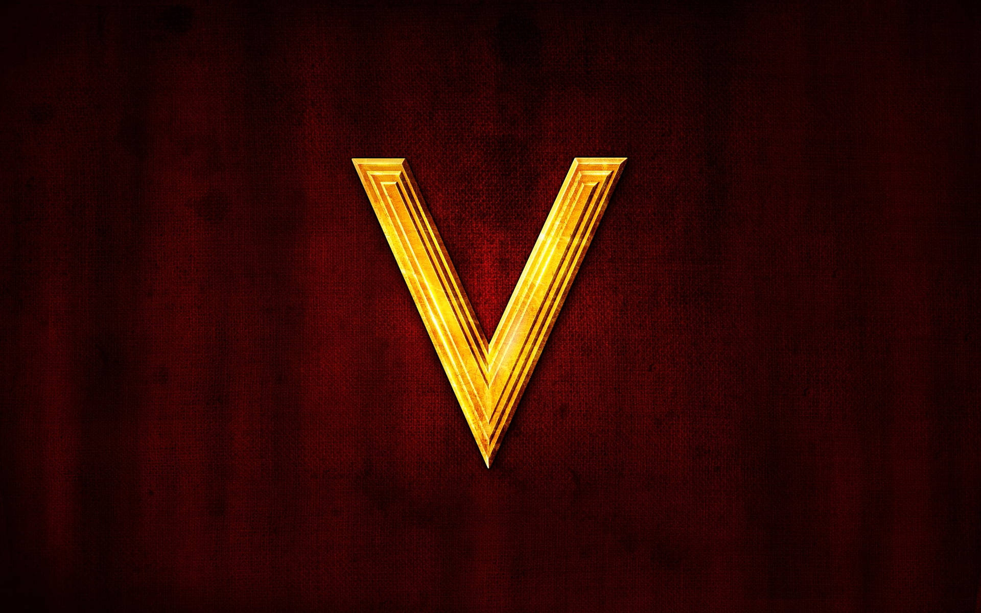 Golden Letter V On Red Background