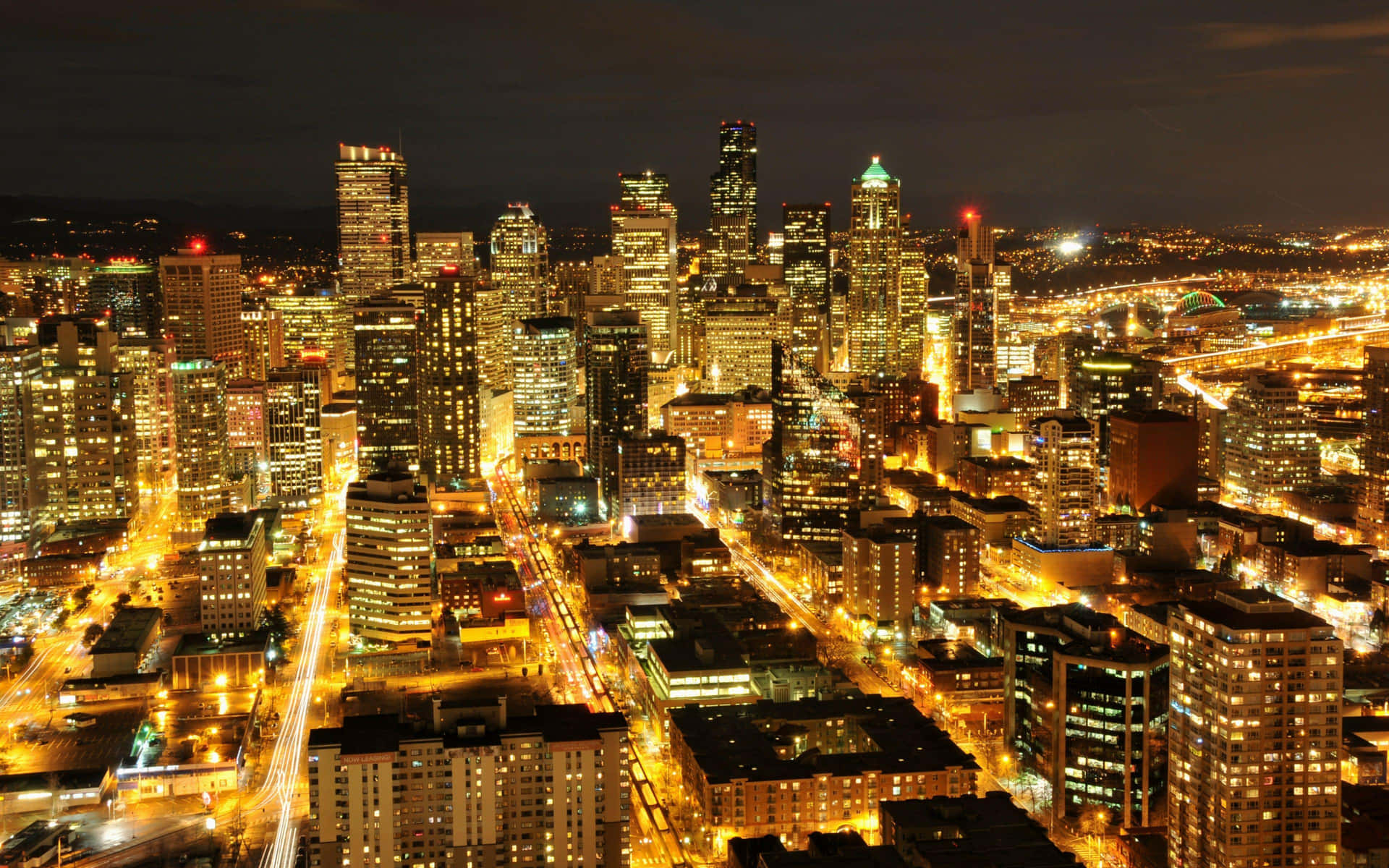 Golden Lights Of Seattle At Night Background