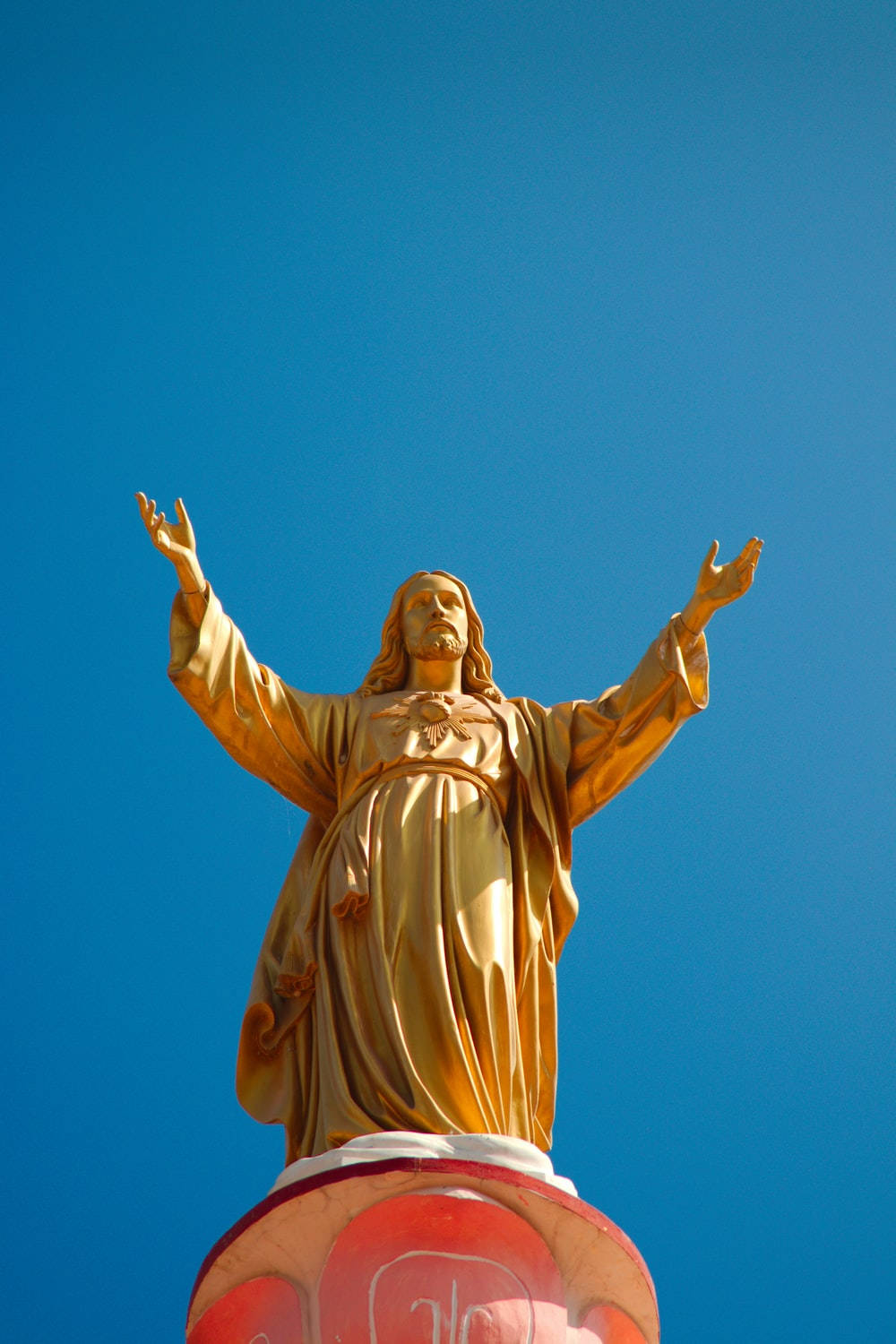 Golden Statue Jesus Phone Background