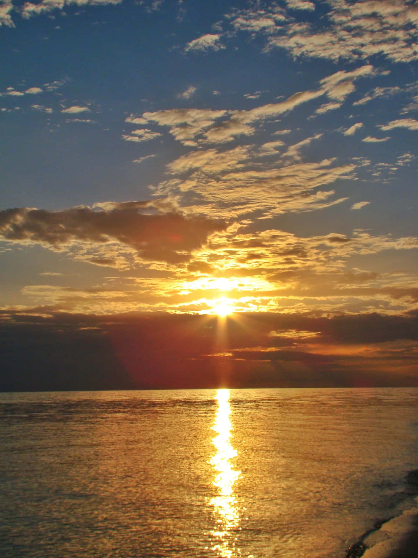 Golden Sunrise Over Ocean.jpg Background