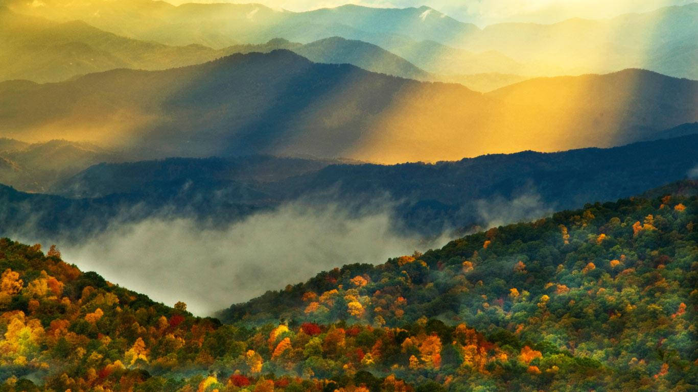 Golden Sunrise Over Smoky Mountains Background