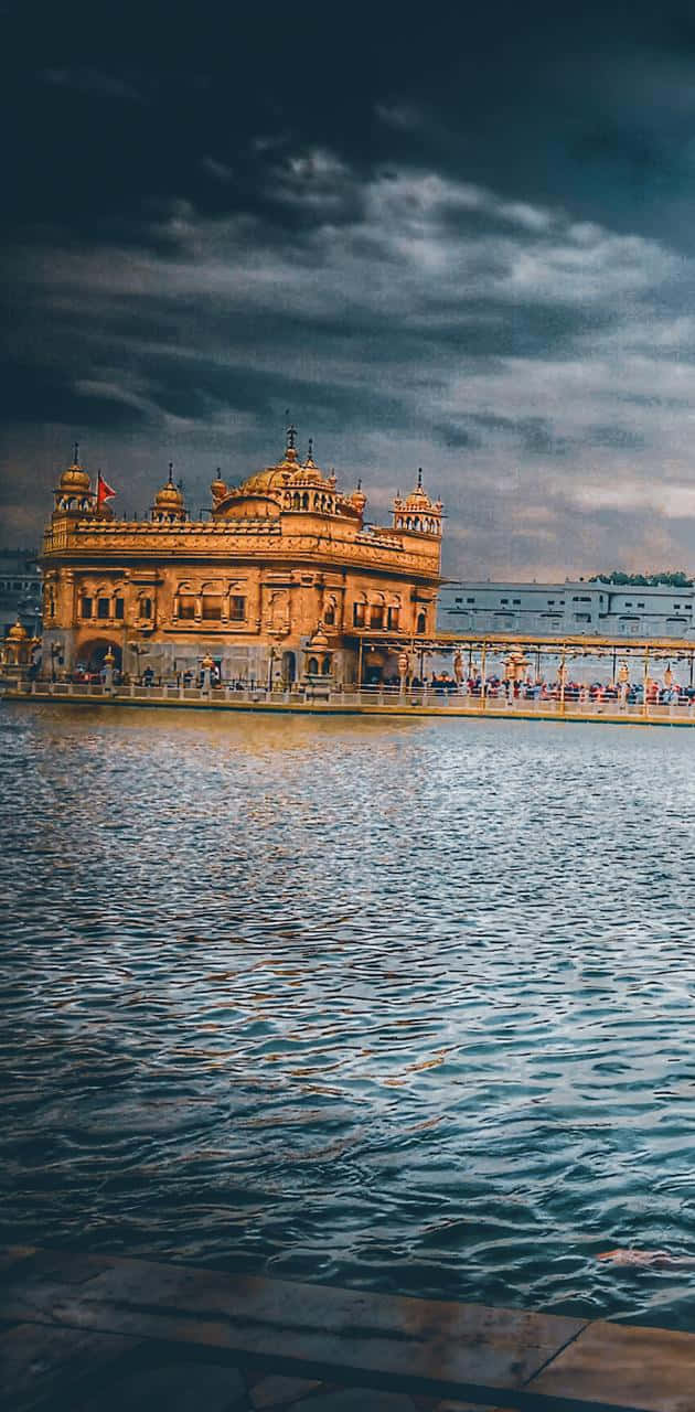 Golden Temple On A Stormy Day Background