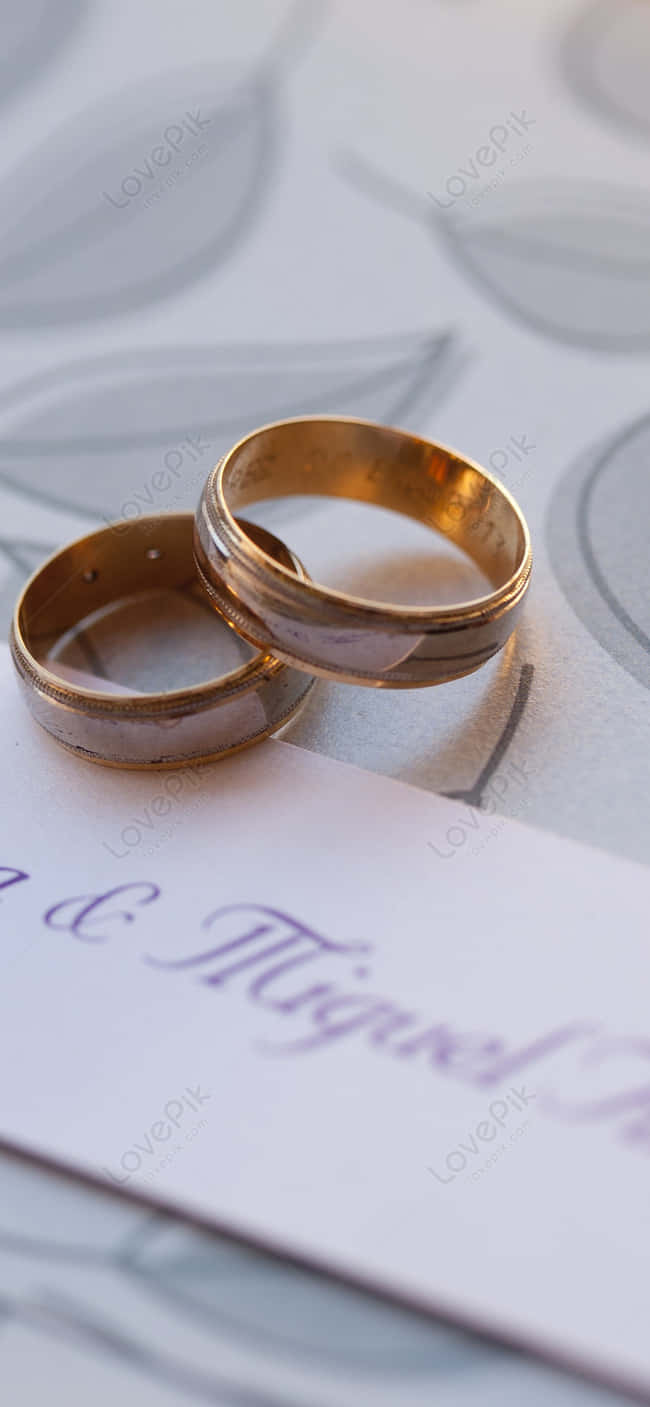 Golden Wedding Ring With Invitation Background