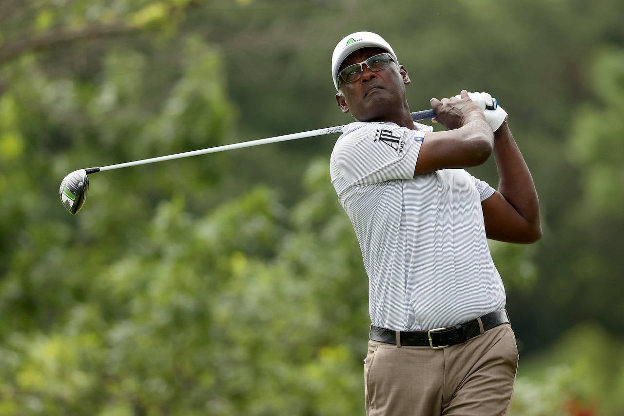 Golf Legend, Vijay Singh, Captured In A Gray Shirt Background