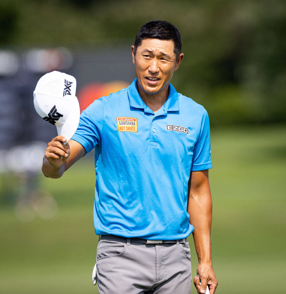 Golf Pro, James Hahn Holding White Cap Background