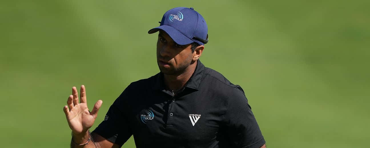 Golfer Gesturing During Game Background