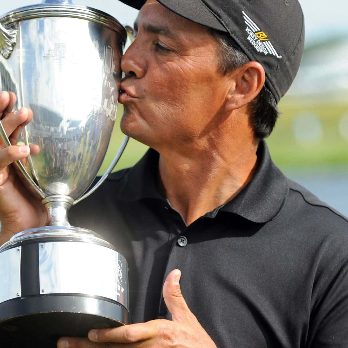 Golfer Kissing Trophy Moment