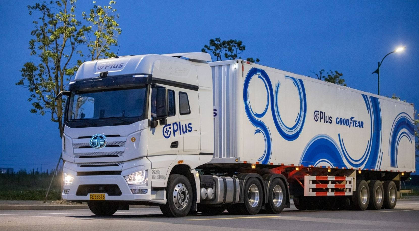 Goodyear’s Self-driving Truck On Highway Background