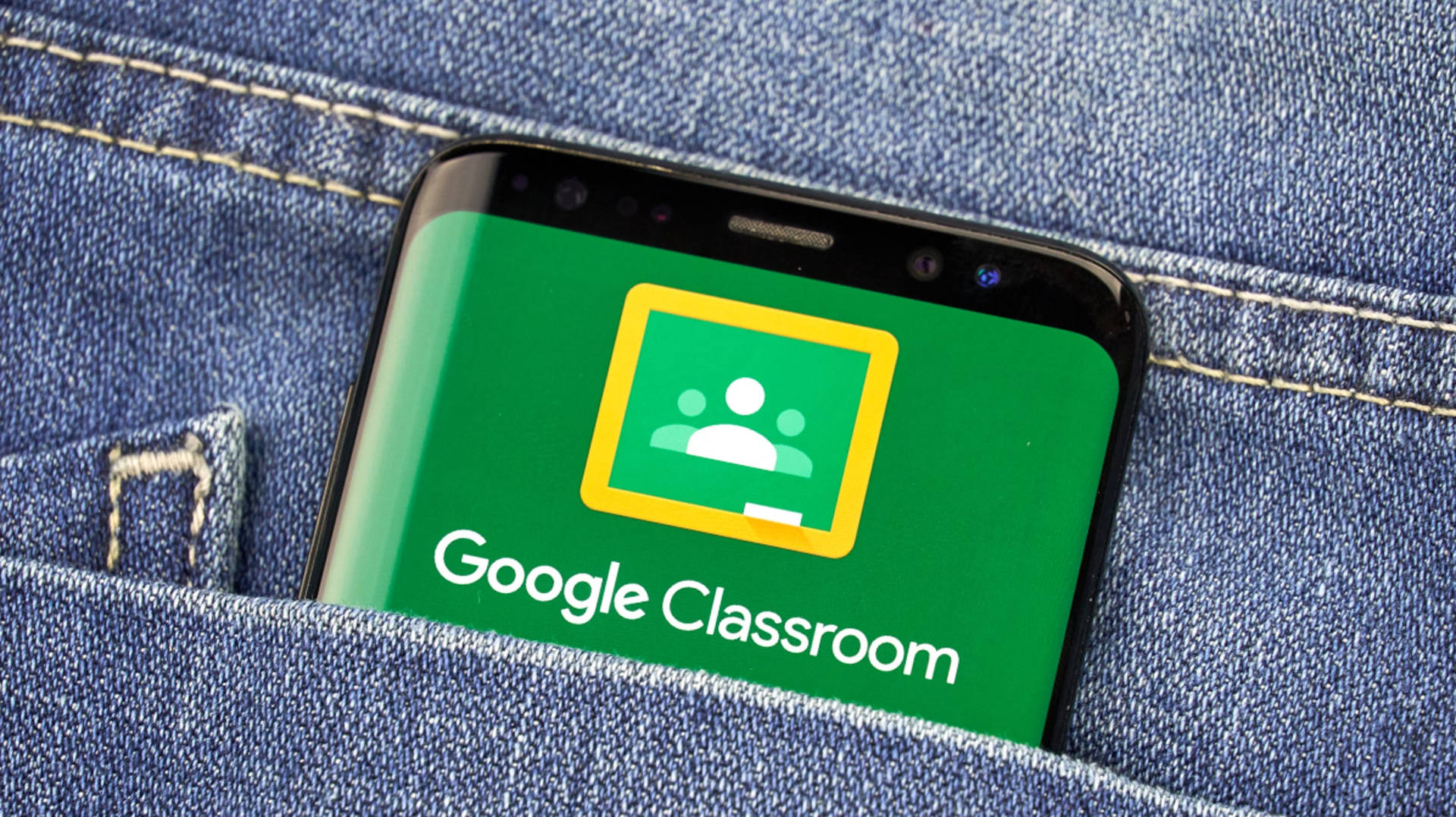 Google Classroom App On Phone In Pocket Background