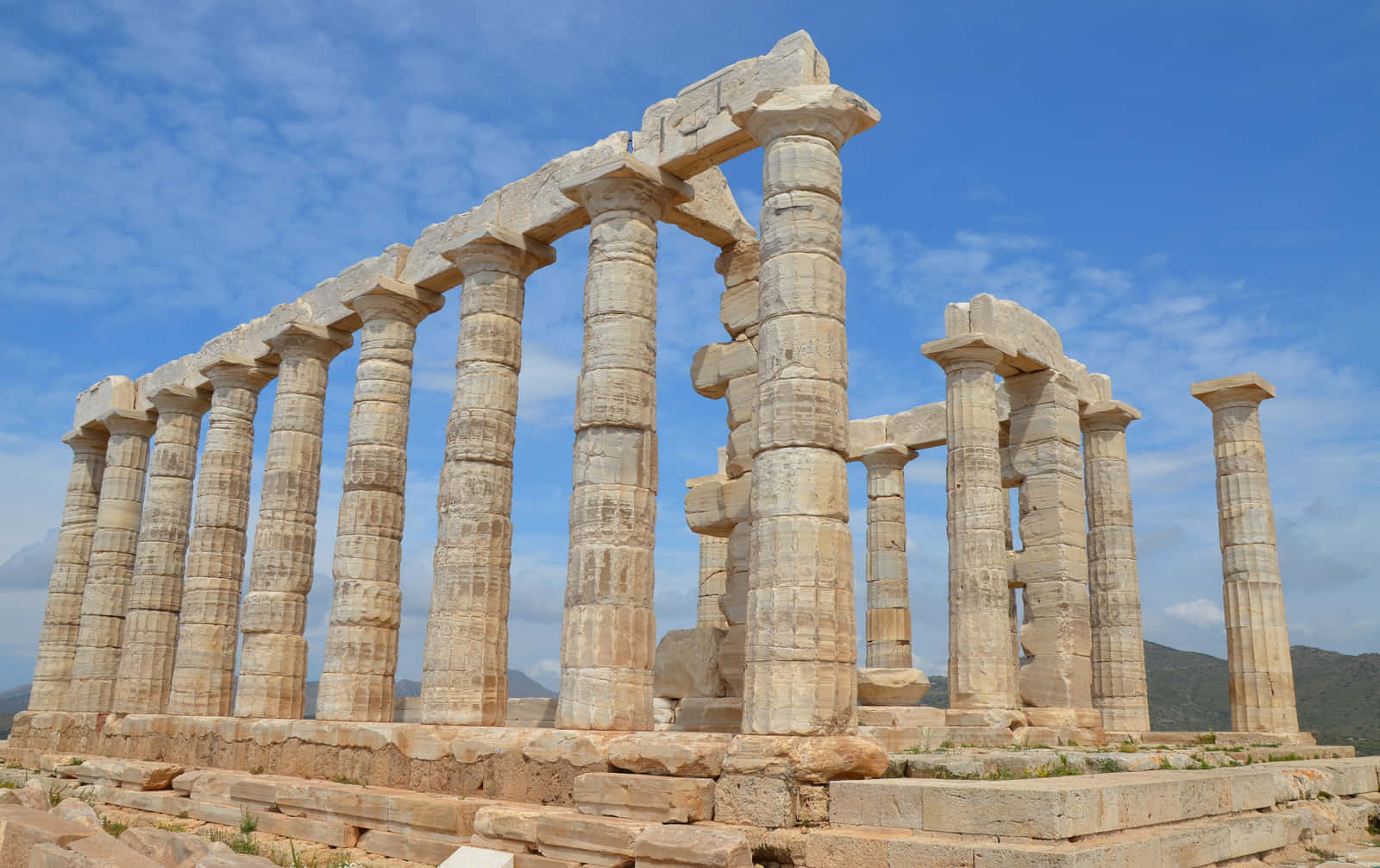 Gorgeous Stone Ruins In Sounion Background