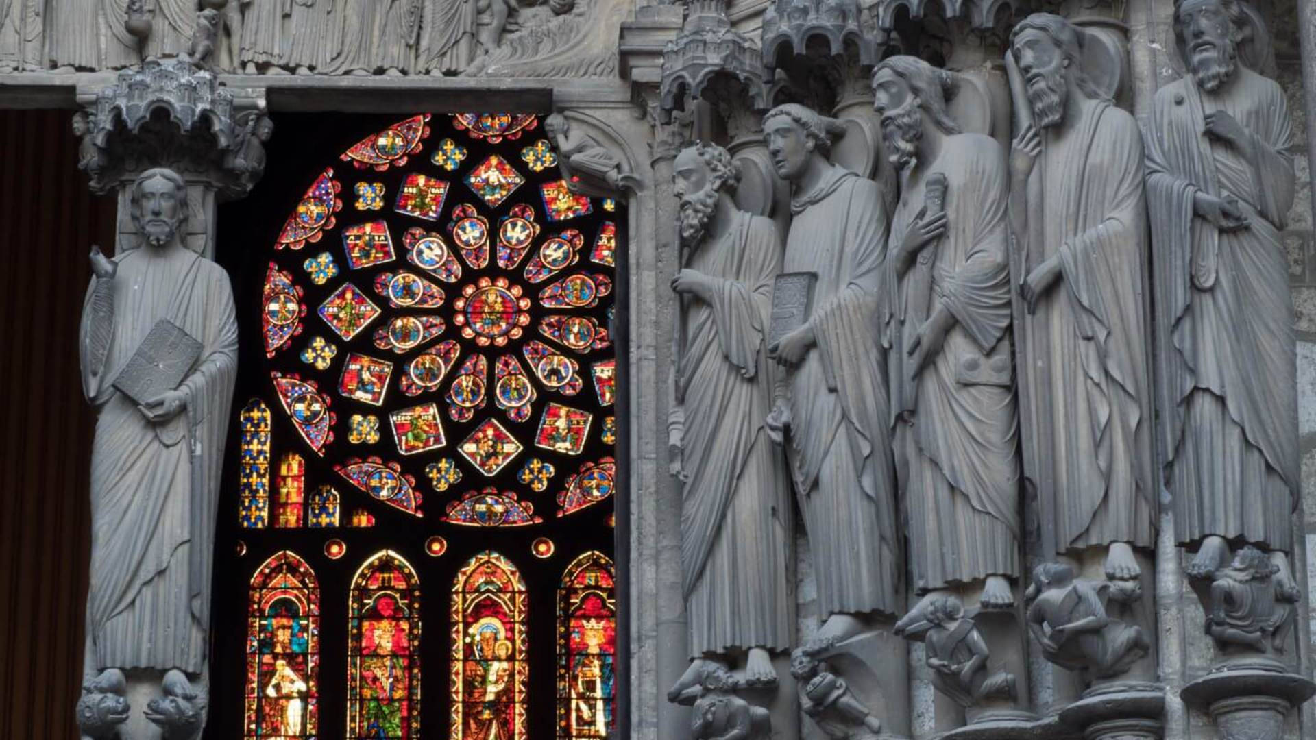 Gothic Statues In Chartres Cathedral Background