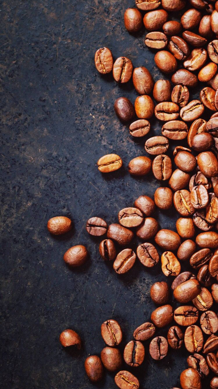 Gourmet Coffee Beans In A Rustic Setting Background