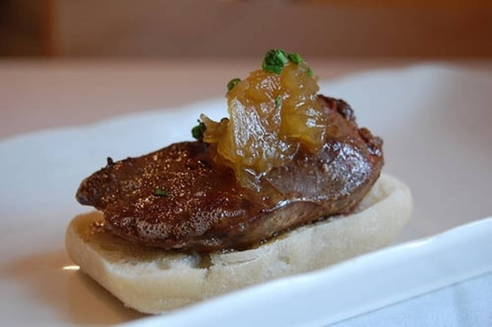 Gourmet Liver Dish Garnished With Caramelized Onions