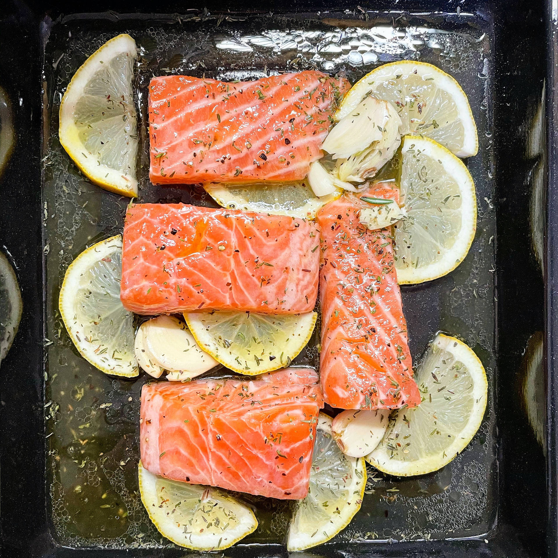 Gourmet Salmon Dish With Lemon Slices Background