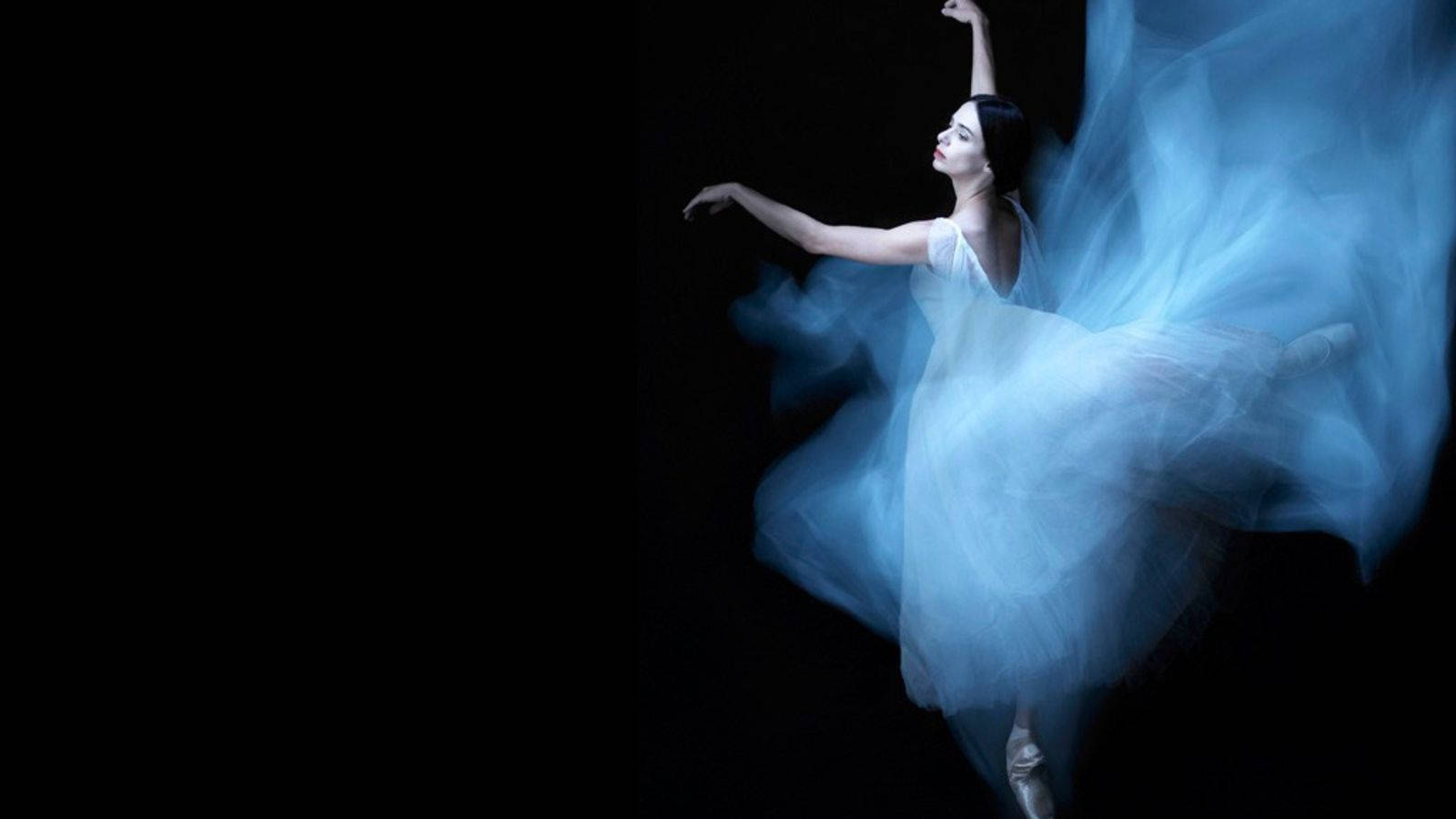 Grace In Motion - Prima Ballerina Alessandra Ferri In The Midst Of A Captivating Dance Pose Background