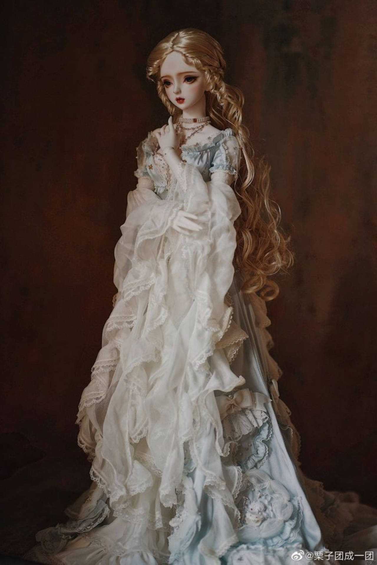 Graceful Barbie Doll Dressed In A Flowy Gown Background