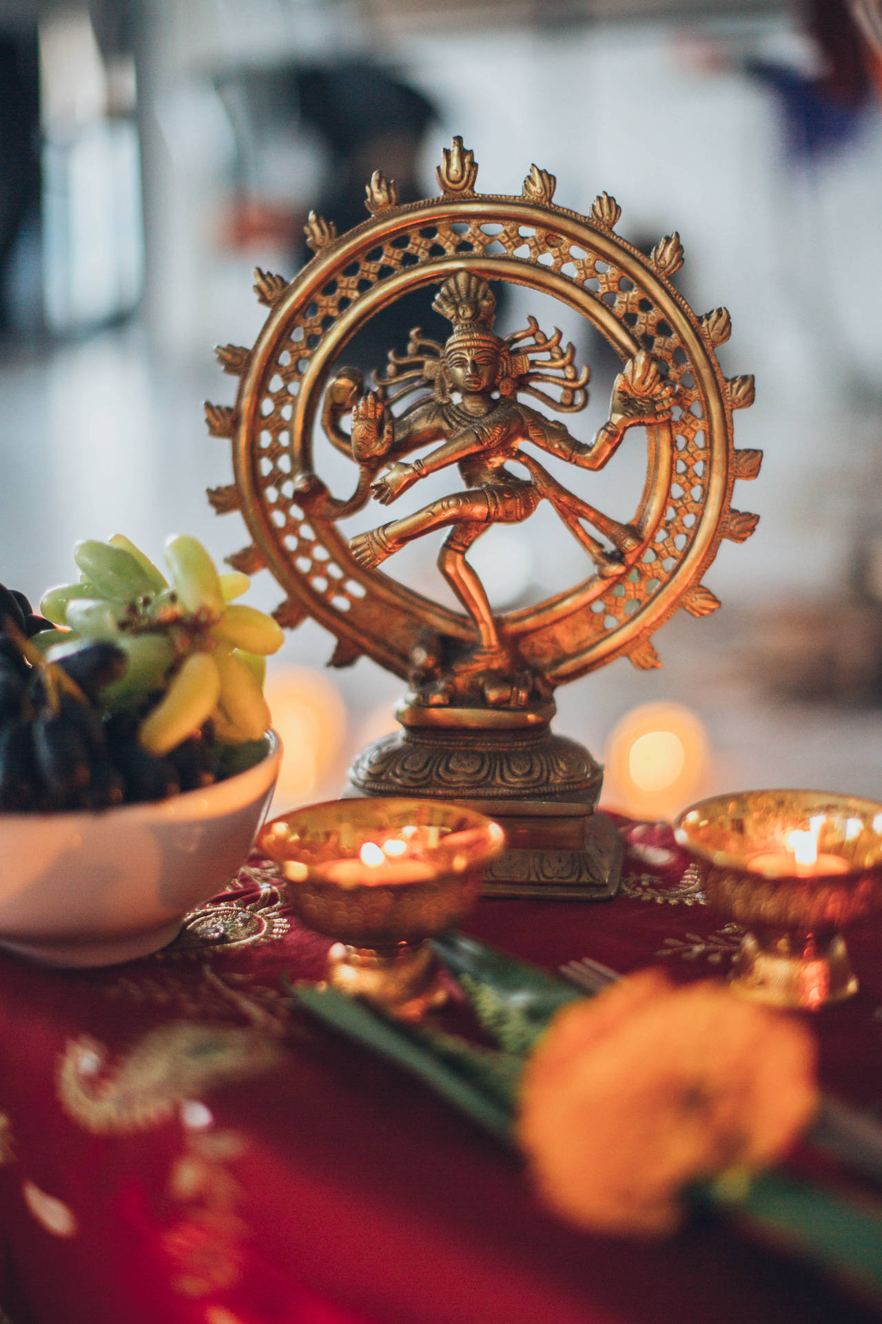 Graceful Nataraja Statue On A Decorated Altar Background