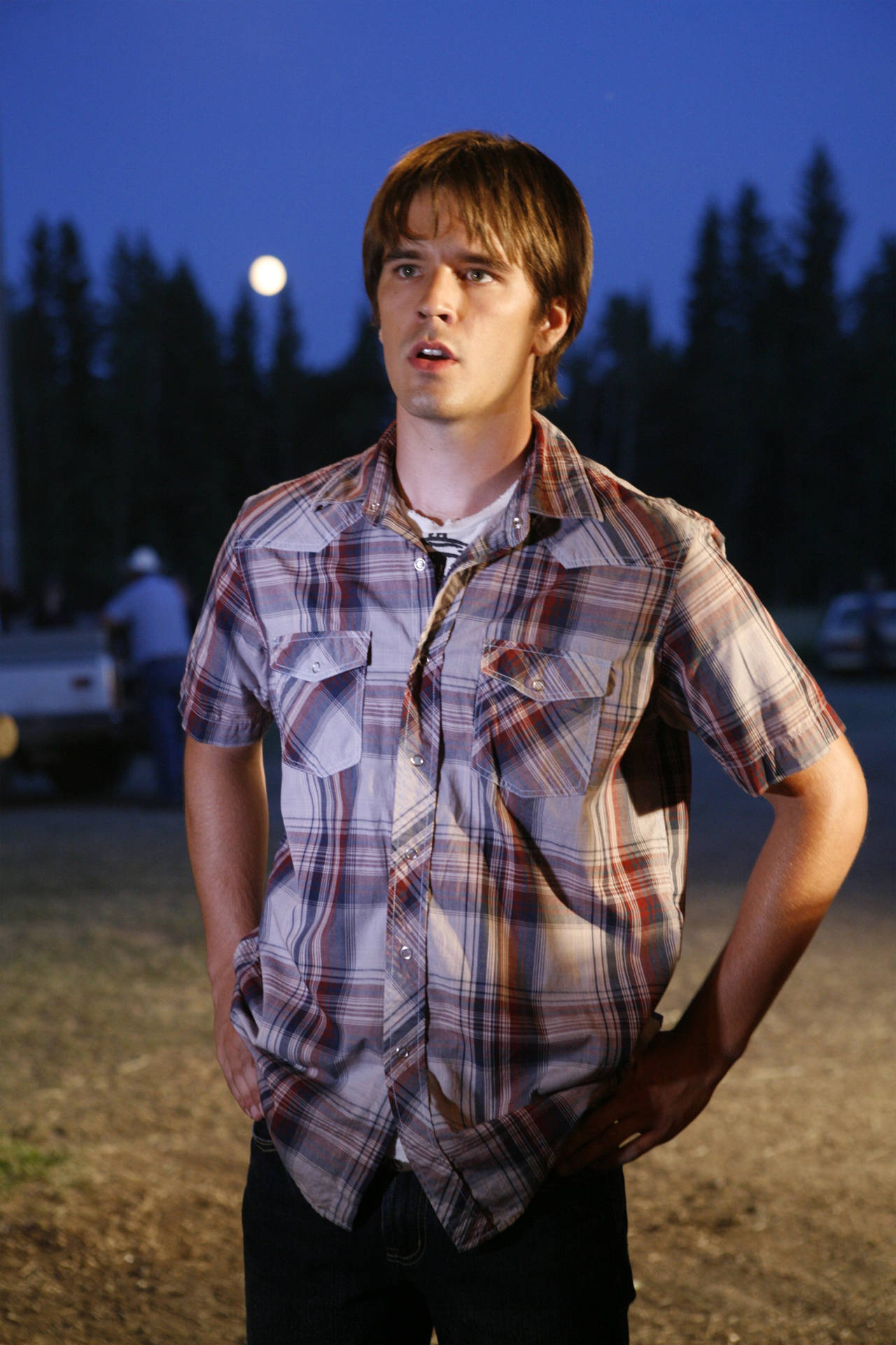 Graham Wardle In Checkered Polo Background