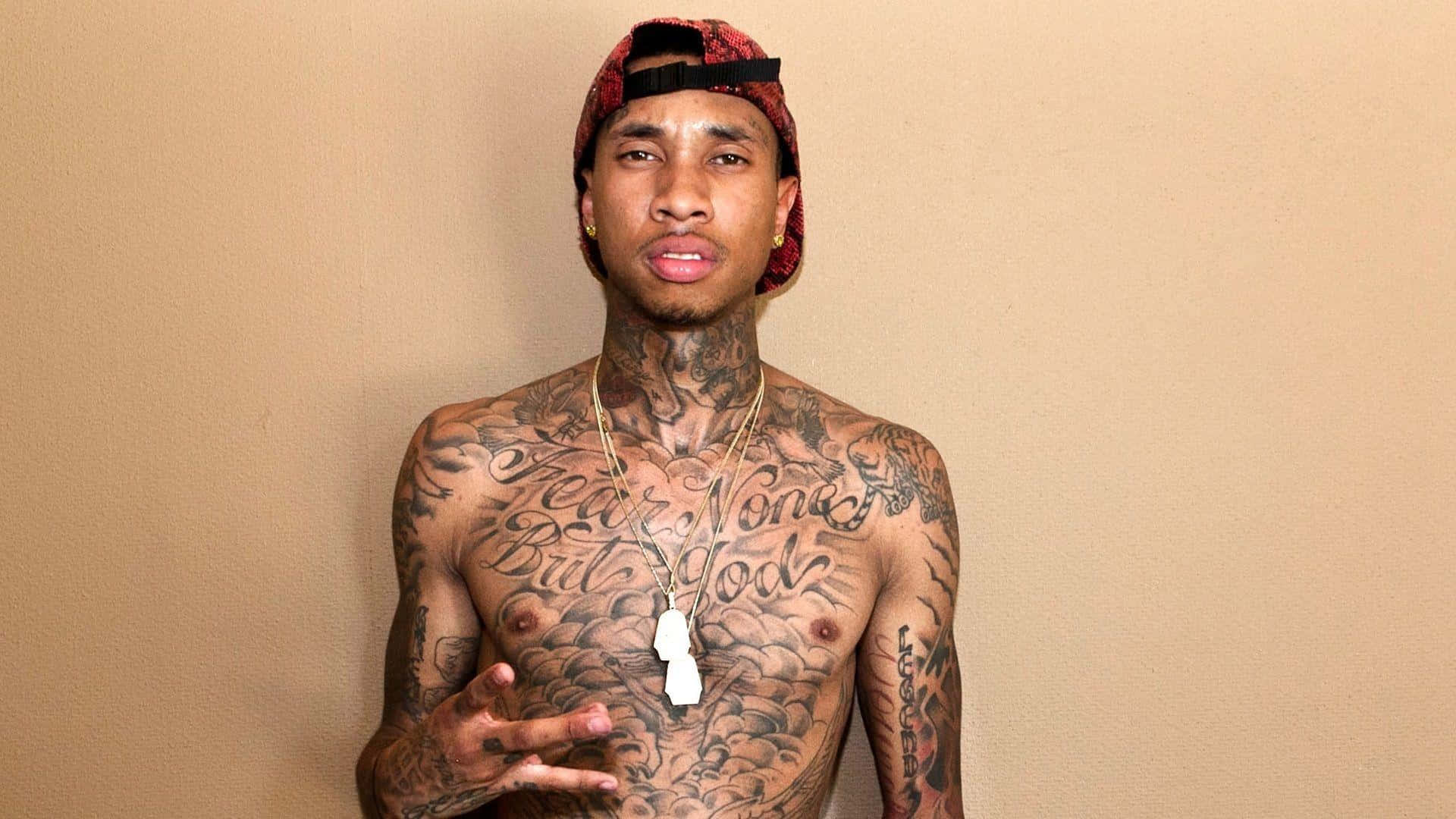 Grammy Award Nominee Tyga Rocks An All Black Ensemble In L.a. Background