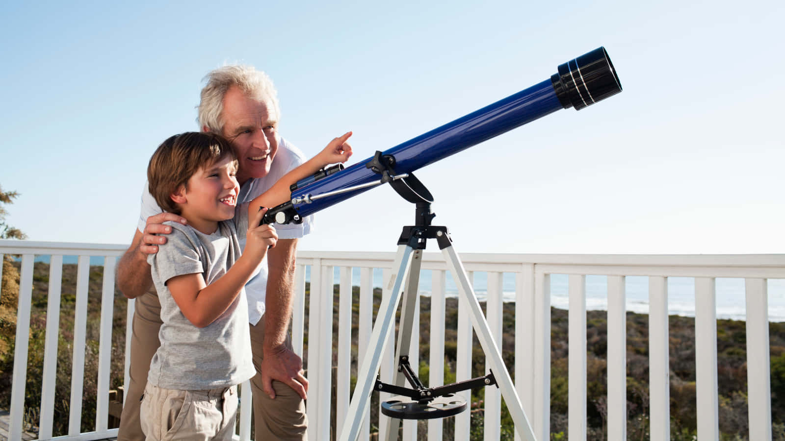 Grandfather And Grandson Using Astronomy Telescope Background