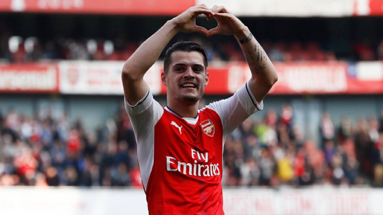 Granit Xhaka Heart Hand Background