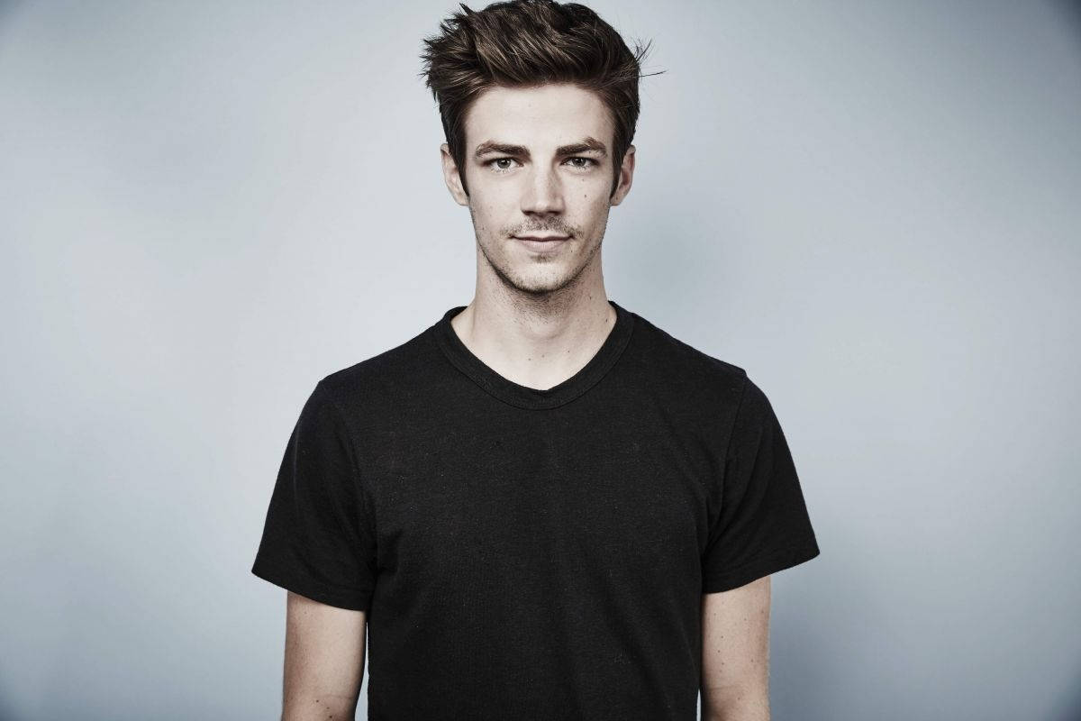 Grant Gustin In Black Casual Background