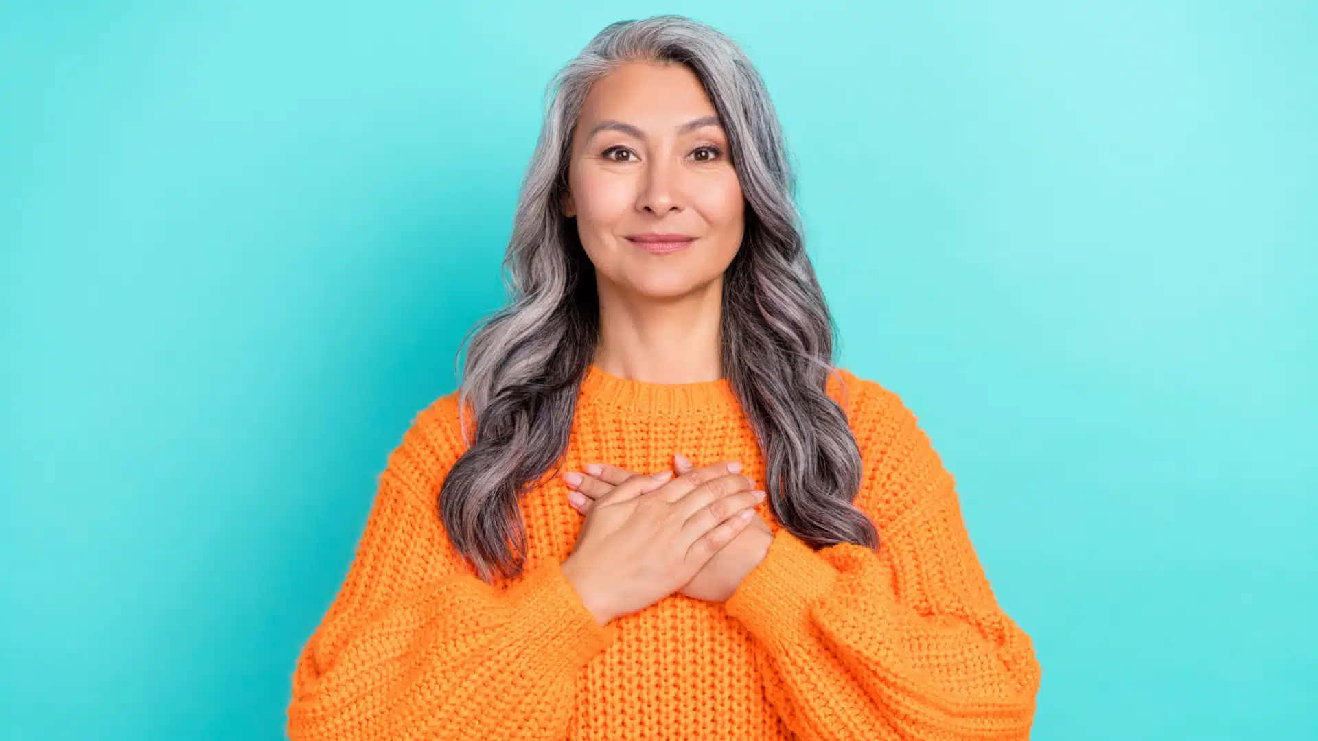 Grateful Middle Aged Woman Orange Sweater Background