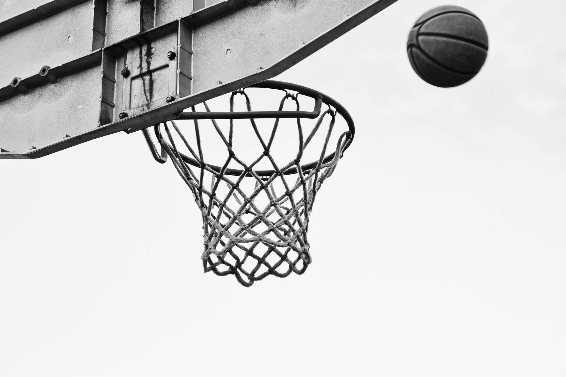Gray Ball Over Basketball Net Ring Background