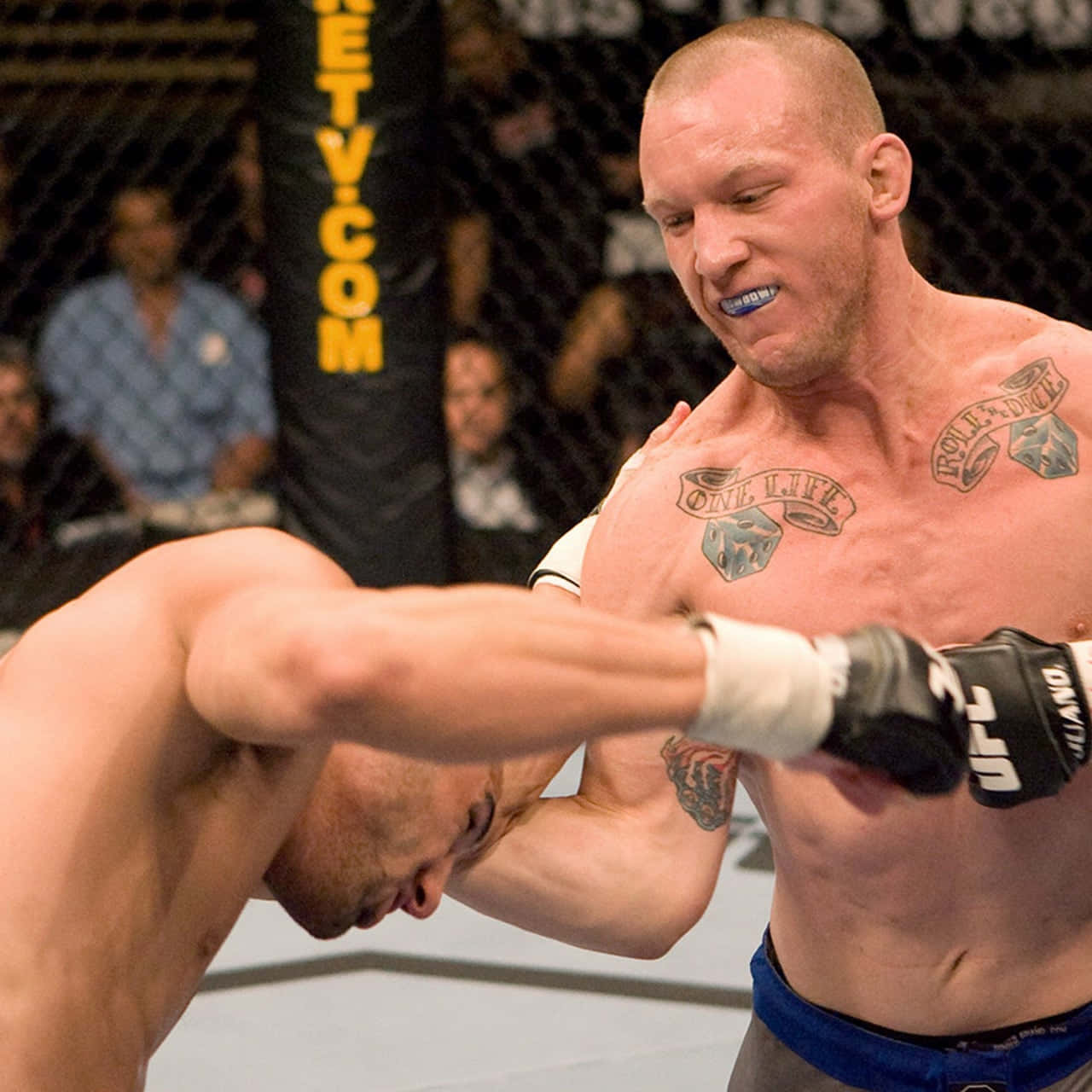 Gray Maynard Punching His Opponent Background