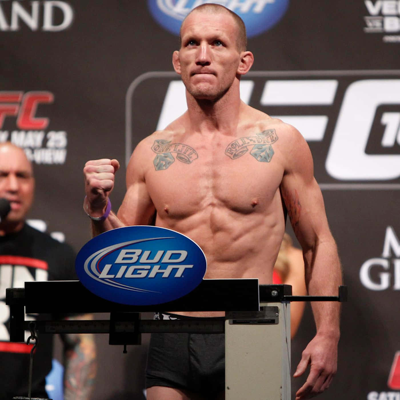 Gray Maynard Standing On Weighing Scale Background