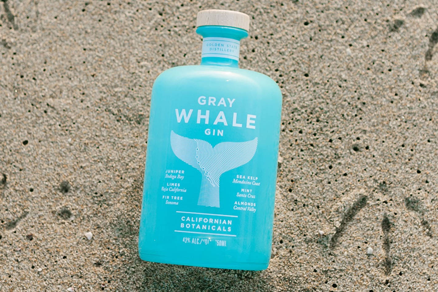 Gray Whale Gin In Sand Background