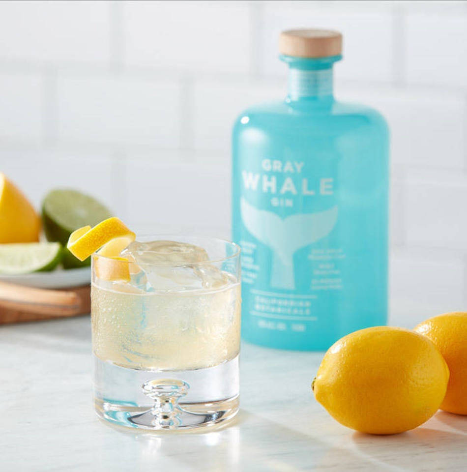 Gray Whale Gin Lemon And Bottle Background