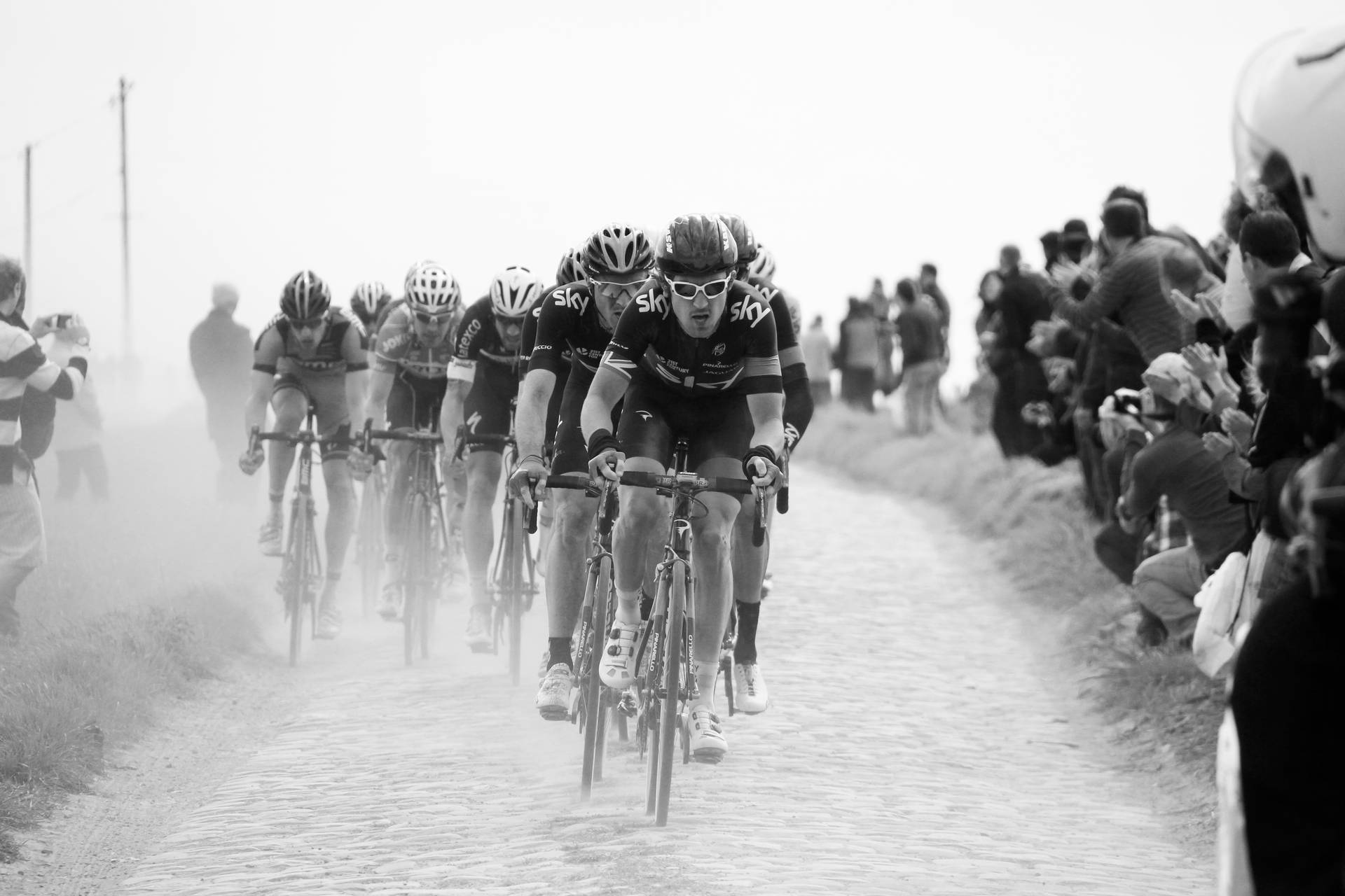 Grayscale Cycling Race On Sand Background