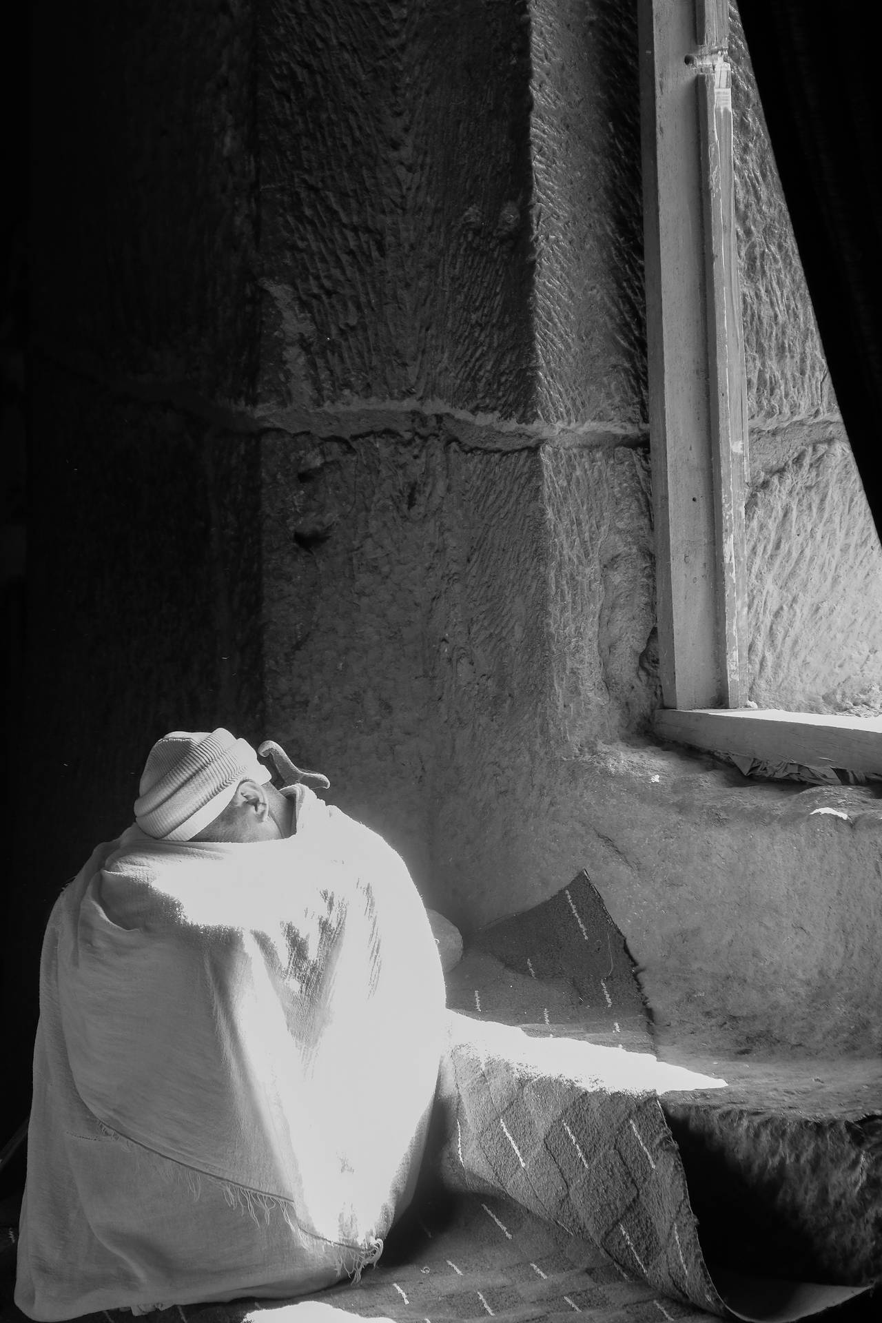 Grayscale Ethiopia Monk Hiding Face Background