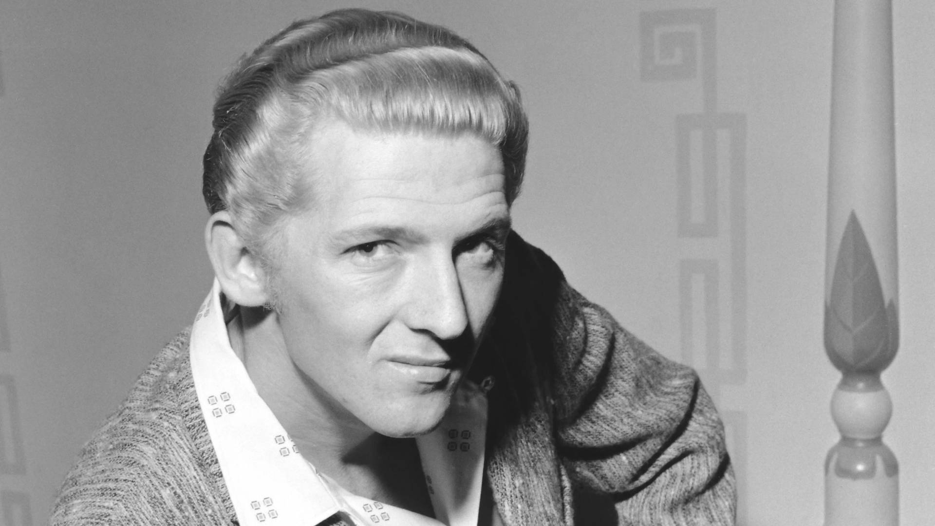 Grayscale Jerry Lee Lewis Leaning Forward Background