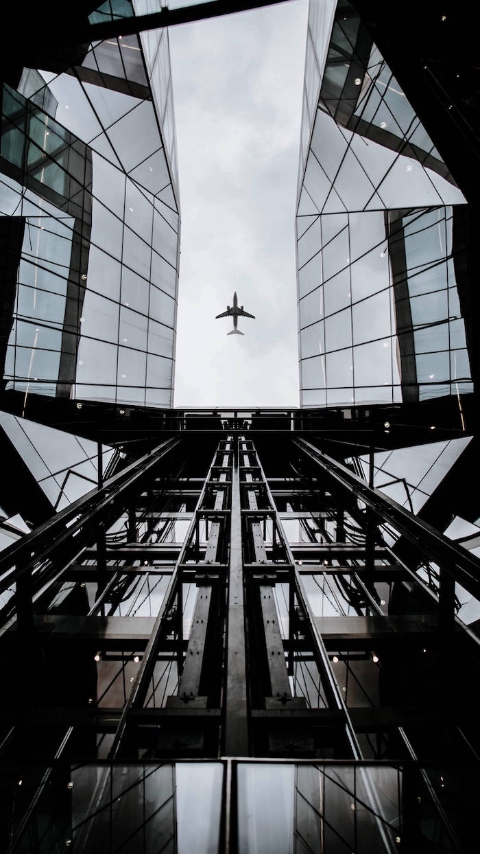 Grayscale Photo Of Glass Buildings Background