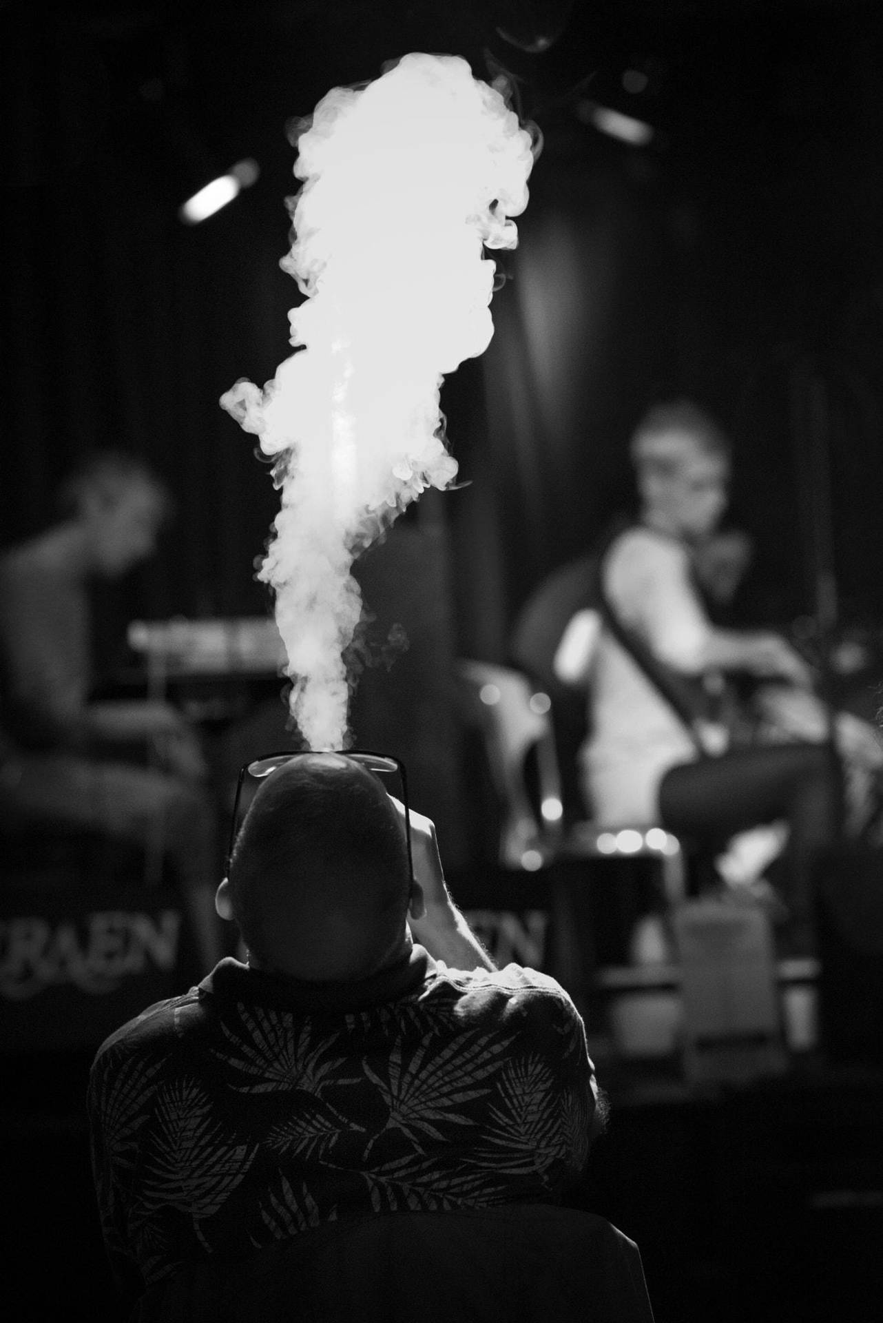 Grayscale Photo Of Man Smoking Blunt