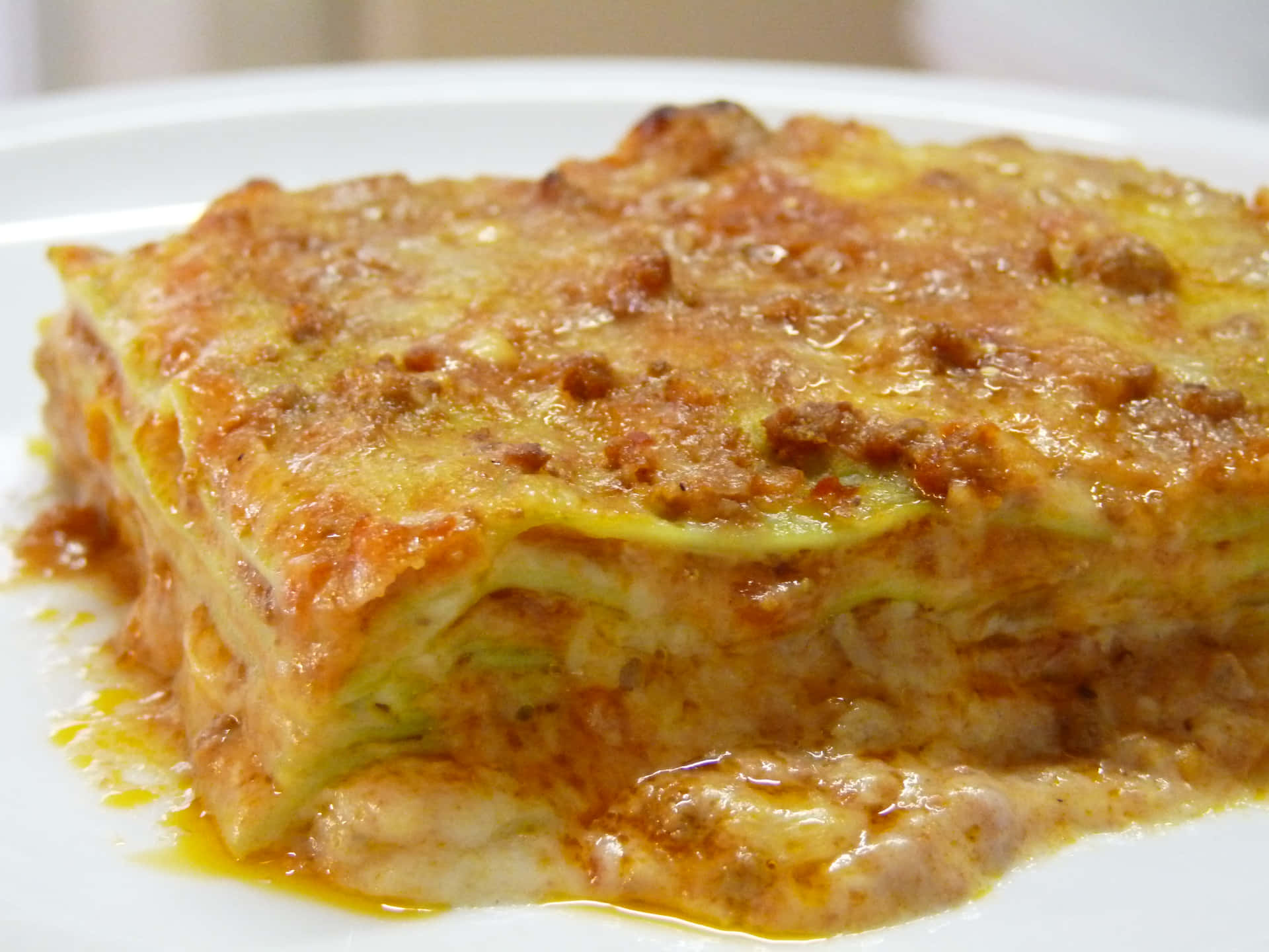 Greasy Plate Of Lasagna Alla Bolognese Background