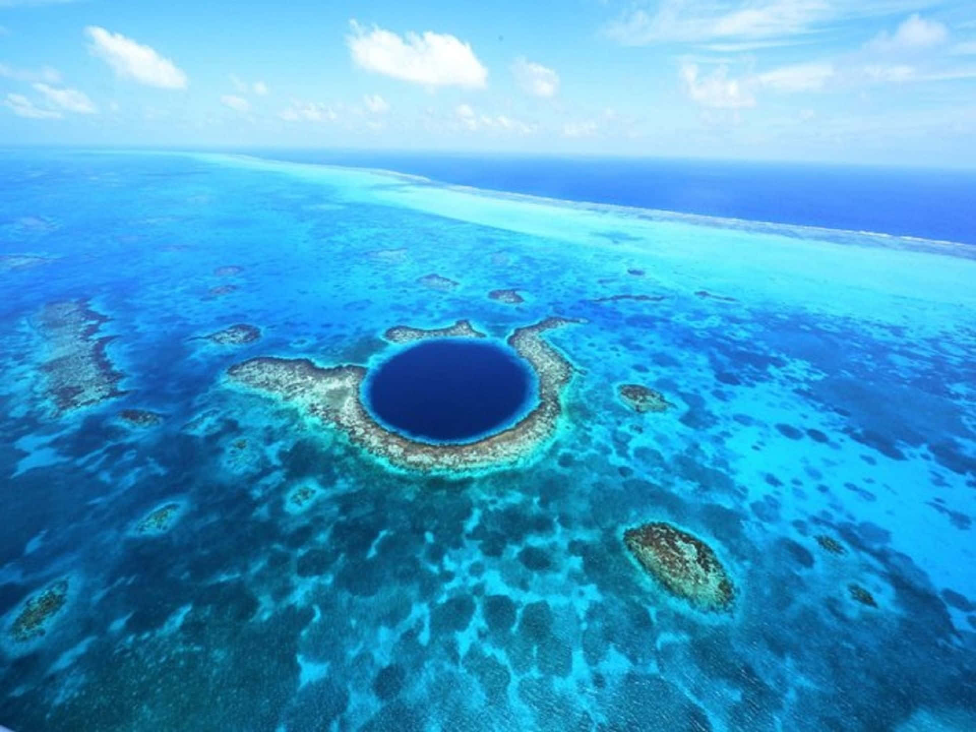 Great Blue Hole Seascape At The Vast Ocean Background