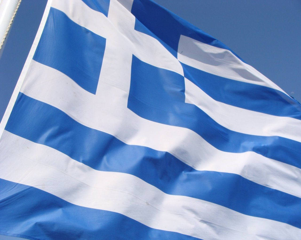 Greece's Flag In Flagpole Background
